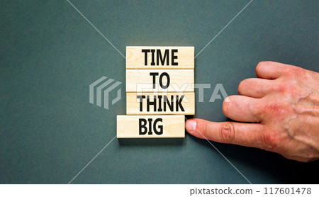 Time to think big symbol. Concept words Time to think big on beautiful wooden block. Beautiful grey table grey background. Businessman hand. Business and time to think big concept. Copy space. 117601478