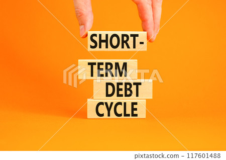 Short-term debt cycle symbol. Concept words Short-term debt cycle on beautiful wooden block. Beautiful orange table background. Businessman hand. Business Short-term debt cycle concept. Copy space. 117601488
