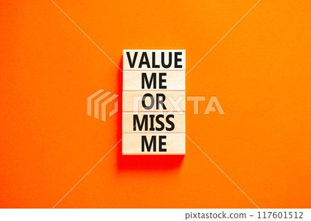 Value or miss me symbol. Concept words Value me or miss me on wooden block. Beautiful orange table orange background. Business psychological and value or miss me concept. Copy space. 117601512