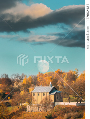 Grodno, Belarus. Moon Rising Above Kalozha Church In Sunny Autumn Day. Church of Sts. Boris and Gleb Grodno, Belarus. Moon Rising Above Kalozha Church In Sunny Autumn Day. Church of Sts. Boris and Gleb 117602481