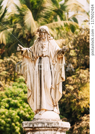 Old Goa, India. Cathedral Of St. Paul And Statue Of Jesus In Sunny Day Old Goa, India. Cathedral Of St. Paul And Statue Of Jesus In Sunny Day 117602484