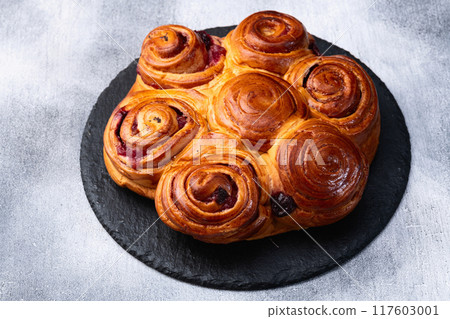 Homemade cake pie roll with cherry . Food background 117603001