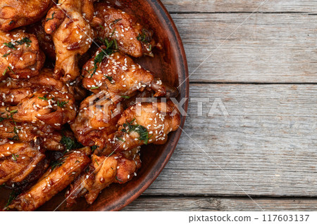 Caramelized in sause chicken wings . Bar-b-q food background photo Caramelized in sause chicken wings . Bar-b-q food background photo 117603137