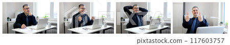 Businessman Giving Thumbs Up While Looking at Computer Screen 117603757