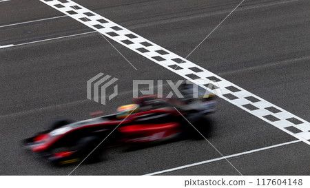 Motion blur race car racing on speed track, Car race on the international circuit race track crossing start and finish line, Race car crossing start and finish line, Target business achieve victory 117604148