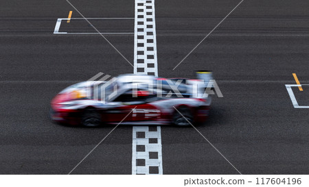 Motion blur race car racing on speed track, Car race on the international circuit race track crossing start and finish line, Race car on road crossing start and finish line, Target business achieve 117604196