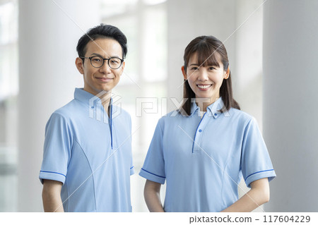 Image of a facility staff member in his 30s looking at the camera wearing a blue polo shirt Image of a facility staff member in his 30s looking at the camera wearing a blue polo shirt 117604229