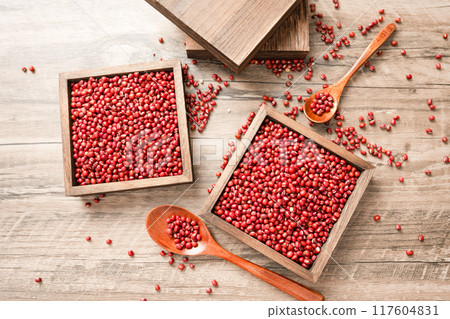Red beans in a wooden box on a wooden board 117604831