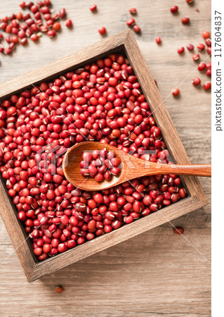 Red beans in a wooden box on a wooden board 117604837