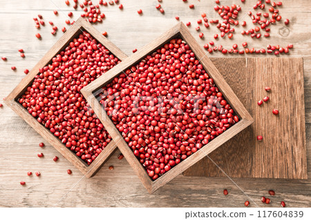 Red beans in a wooden box on a wooden board Red beans in a wooden box on a wooden board 117604839