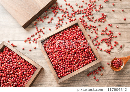 Red beans in a wooden box on a wooden board Red beans in a wooden box on a wooden board 117604842