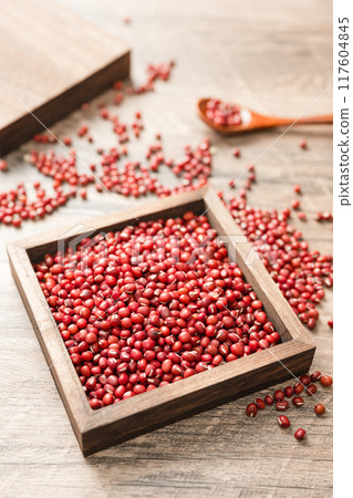 Red beans in a wooden box on a wooden board Red beans in a wooden box on a wooden board 117604845