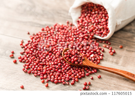 Red beans in cloth bag on wooden board Red beans in cloth bag on wooden board 117605015
