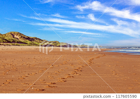 Picture of a deserted beach with dunes and footprints in Scotland during the day Picture of a deserted beach with dunes and footprints in Scotland during the day 117605590