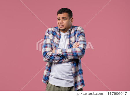 Confused young man, shoulders up - can't help, makes gesture of I dont know Confused young man, shoulders up - can't help, makes gesture of I dont know 117606047