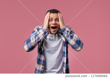 Screaming biracial man. Amazed guy glad, happy, surprised. excited dude on pink. 117606068