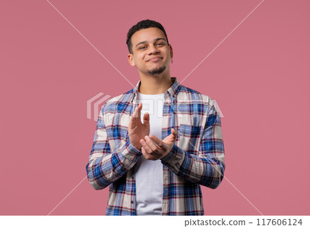Smiling african man claps hands, congratulating. Support, cheering, gratitude 117606124