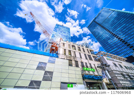Tokyo cityscape in Japan, August. Goodbye, Shibuya Station West Exit... Demolition is progressing and the left side of the building has disappeared... Blue sky is visible = 20th 117606968