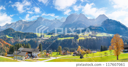 Breathtaking view of  Alpine green fields and traditional wooden houses near Abtenau village at autumn sunny day. 117607061
