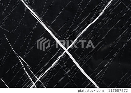 A natural pattern of black and white marble stone with veins. A natural pattern of black and white marble stone with veins. 117607272