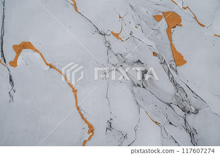 Background with a texture of gray marble and white gold with a pattern. Background with a texture of gray marble and white gold with a pattern. 117607274
