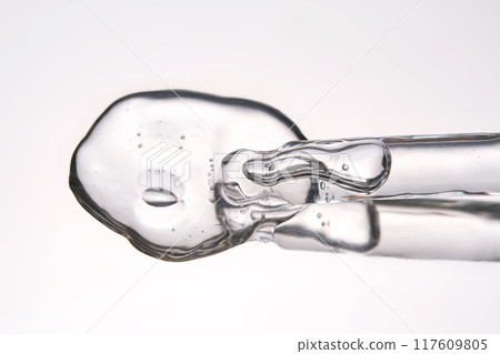 Pipette with cosmetic gel or serum close-up. 117609805