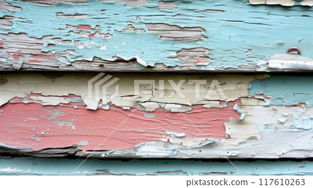 Peeling paint on weathered wooden siding. 117610263