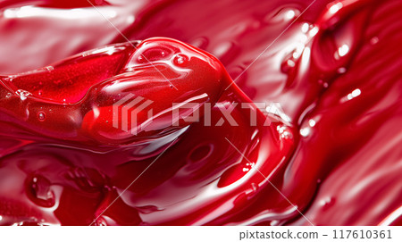 Glossy red paint creating a fluid, wavy pattern. Glossy red paint creating a fluid, wavy pattern. 117610361