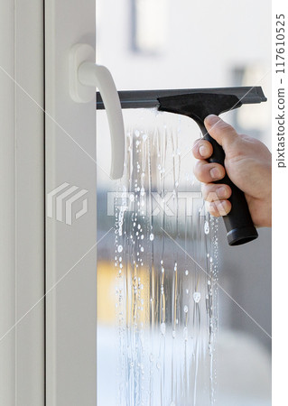 Installation of tinted film. Ultraviolet and energy afficiency concept. 117610525