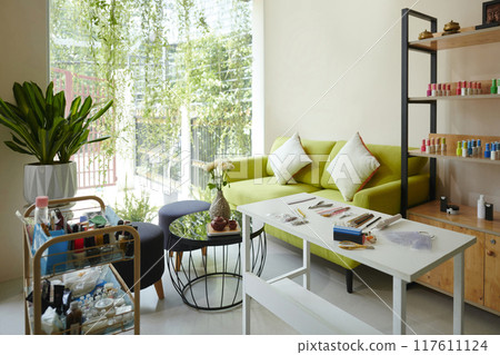Cozy Living Room Setting with Vibrant Green Sofa Cozy Living Room Setting with Vibrant Green Sofa 117611124