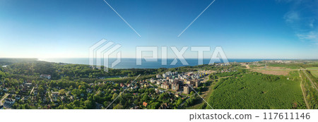 Baltic sea coastline with Svetlogorsk town. Aerial panorama view. Long banner Baltic sea coastline with Svetlogorsk town. Aerial panorama view. Long banner 117611146