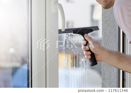 Installation of tinted film. Ultraviolet and energy afficiency concept. 117611346