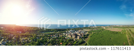 Baltic sea coastline with Svetlogorsk town. Aerial panorama view. Long banner Baltic sea coastline with Svetlogorsk town. Aerial panorama view. Long banner 117611413