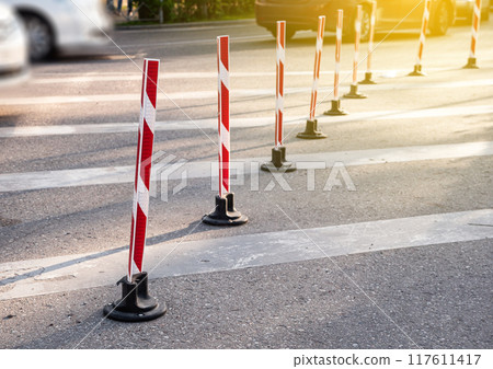 Road poles with red stripes for pakring and drive control Road poles with red stripes for pakring and drive control 117611417