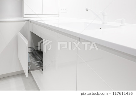 Open kitchen drawer with metal dish dry rack Open kitchen drawer with metal dish dry rack 117611456