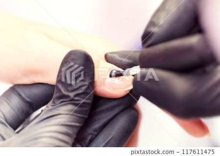 Process of making manicure in salon. 117611475