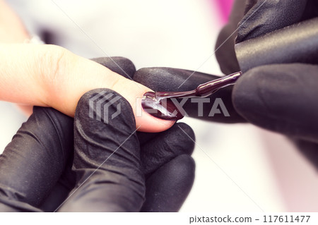 Process of making manicure in salon. Process of making manicure in salon. 117611477
