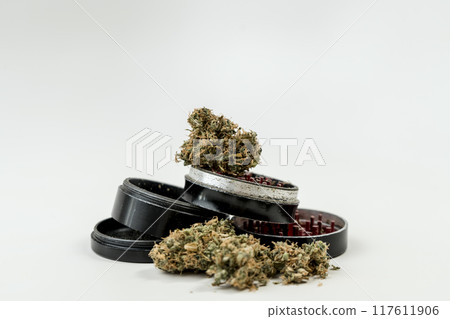 Medical marijuana buds with grinder on white background, close up 117611906