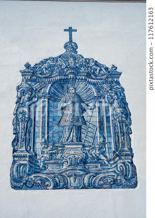 Front facade wall with historical art ornaments and portuguese azulejo of Church Saint Lawrence, Almancil, Portugal Front facade wall with historical art ornaments and portuguese azulejo of Church Saint Lawrence, Almancil, Portugal 117612163