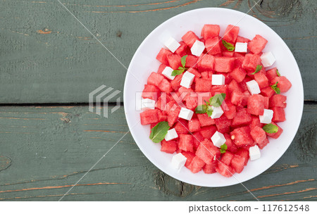 Summer watermelon salad with feta cheese and mint 117612548