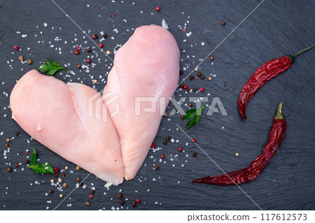 Raw chicken meat fillet ( breast ) in form Heart  . Valentine day food 117612573