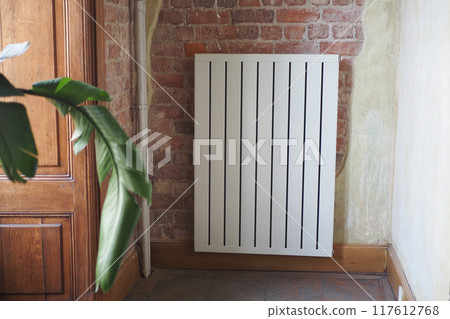 White radiator on grey white wall. apartment heating installation system, White radiator on grey white wall. apartment heating installation system, 117612768