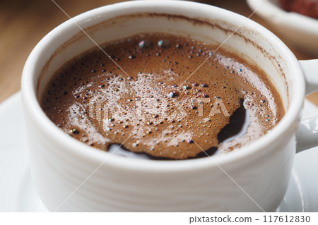 a cup of turkish coffee on table  117612830