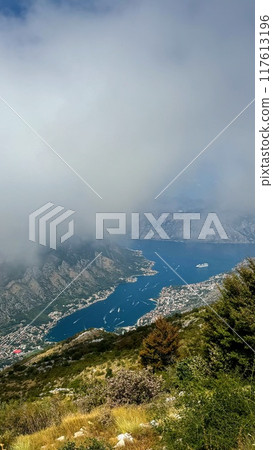 Misty View of Coastal Town and Bay Misty View of Coastal Town and Bay 117613196