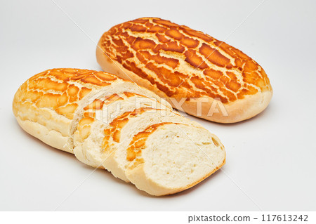 Freshly baked tiger bread loaf with crispy golden crust, perfect for sandwiches and toast 117613242