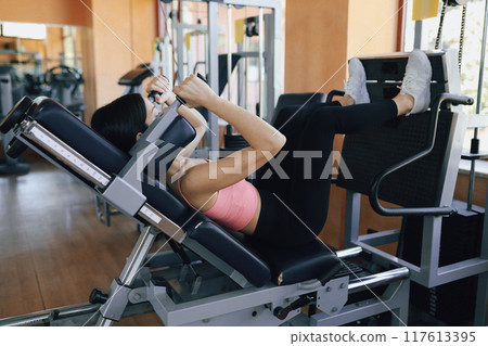 The Routine Exercise Of A Woman In The Gym  117613395