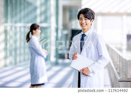 Men and women in white coats 117614492