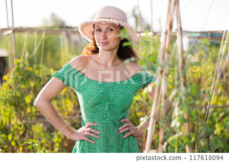 Adult woman posing in garden 117618094