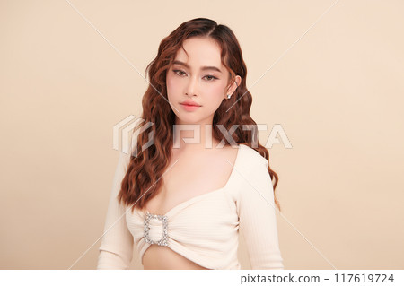 Beautiful young asian woman with clean fresh skin on beige background, Face care, Facial treatment, Cosmetology, beauty and spa, Asian women portrait. Beautiful young asian woman with clean fresh skin on beige background, Face care, Facial treatment, Cosmetology, beauty and spa, Asian women portrait. 117619724