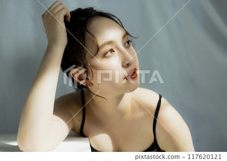 Portrait of a woman in a black dress 117620121